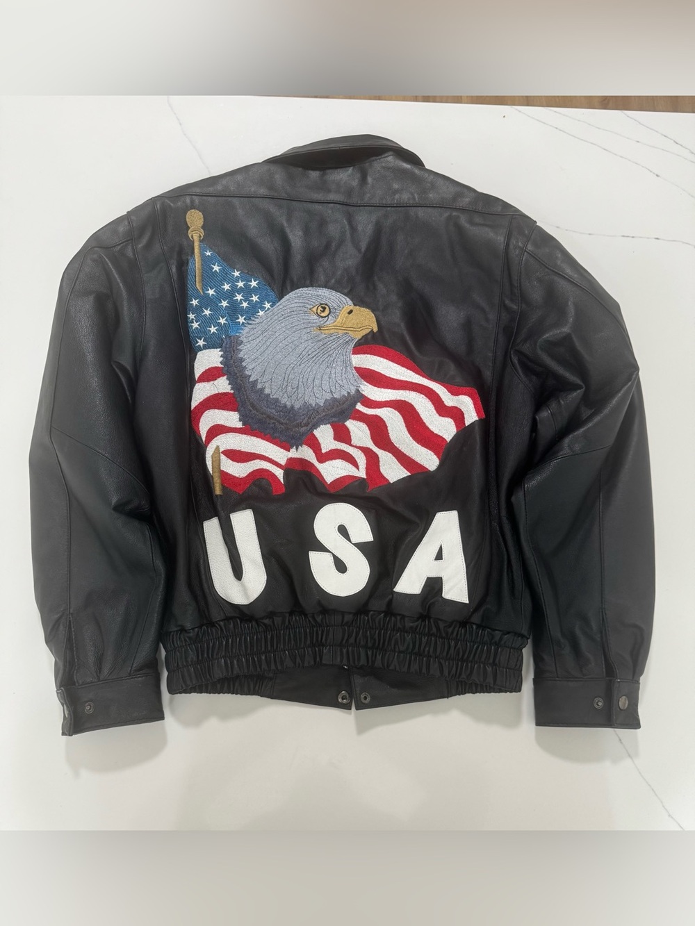 Vintage black leather bomber jacket with massive embroidered bald eagle